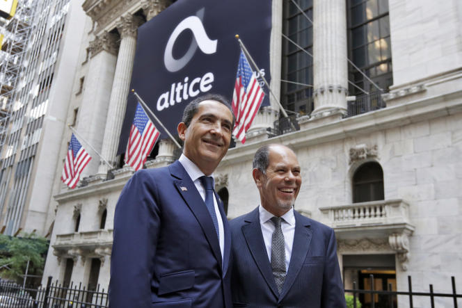 Les cofondateurs d’Altice, Patrick Drahi (à gauche) et Armando Pereira, lors de l’introduction du groupe de télécommunications à la Bourse de New York, le 22 juin 2017.